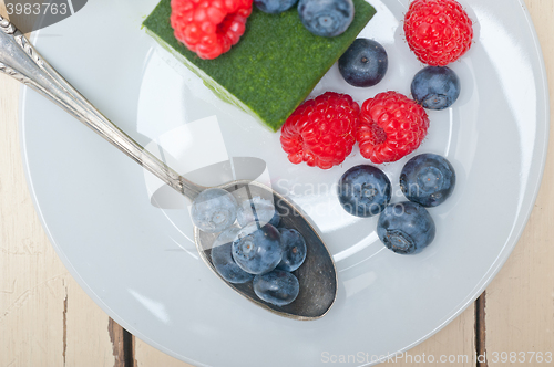 Image of green tea matcha mousse cake with berries