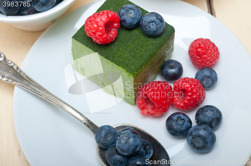 Image of green tea matcha mousse cake with berries