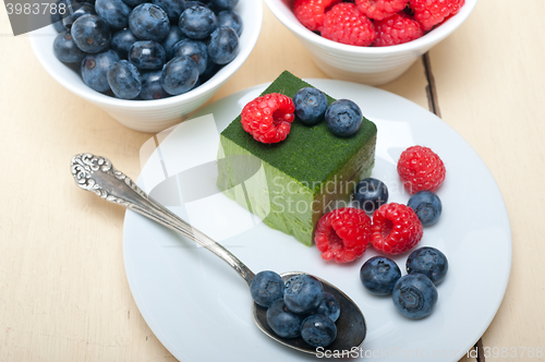 Image of green tea matcha mousse cake with berries