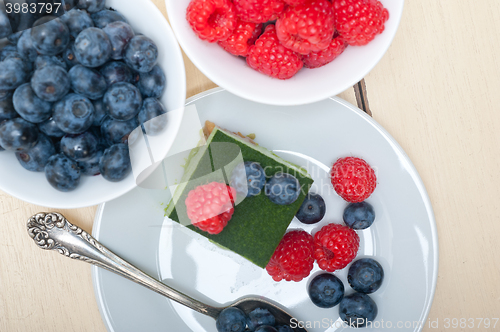 Image of green tea matcha mousse cake with berries