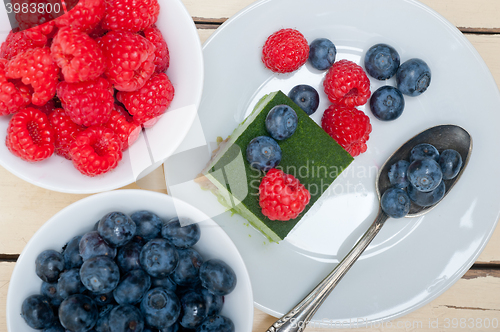 Image of green tea matcha mousse cake with berries