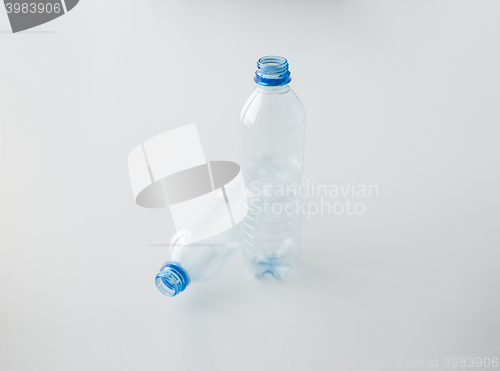 Image of close up of empty used plastic bottles on table