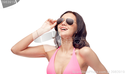 Image of happy woman in sunglasses and bikini swimsuit