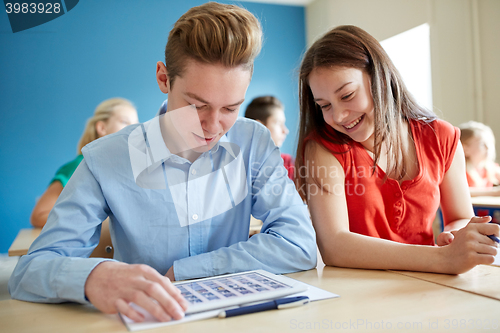 Image of happy students with tablet pc computer at school