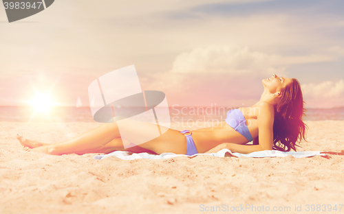 Image of happy woman on the beach