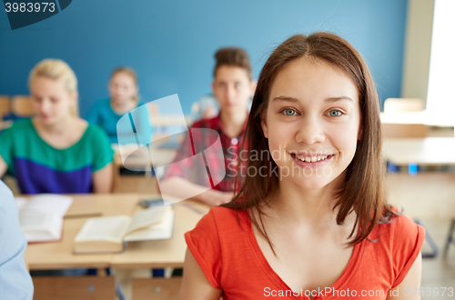 Image of happy student girl at school lesson