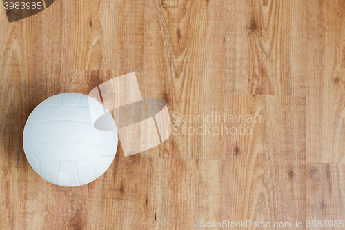 Image of close up of volleyball ball on wooden floor