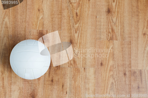 Image of close up of volleyball ball on wooden floor