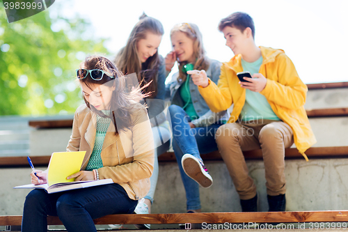 Image of student girl suffering of classmates mockery