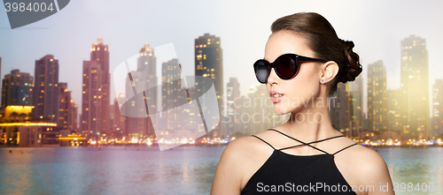 Image of beautiful young woman in elegant black sunglasses