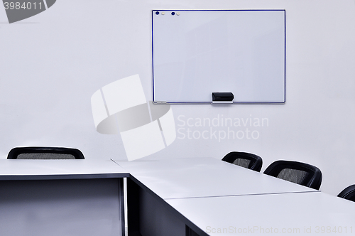 Image of Empty meeting room in the office with tables and chairs