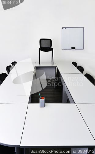 Image of Empty meeting room in the office with tables and chairs