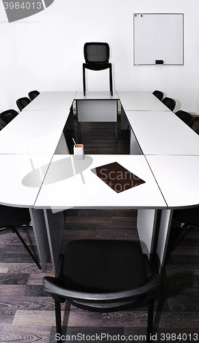 Image of Empty meeting room in the office with tables and chairs