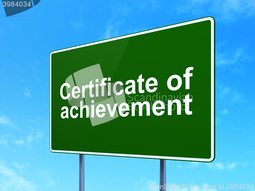 Image of Studying concept: Certificate of Achievement on road sign background