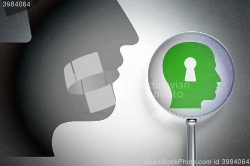 Image of Studying concept:  Head With Keyhole with optical glass on digital background