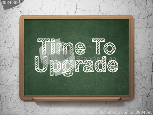 Image of Time concept: Time To Upgrade on chalkboard background