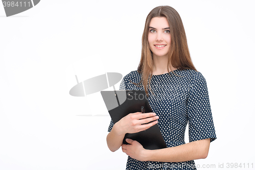 Image of Portrait of smiling business woman with paper folder