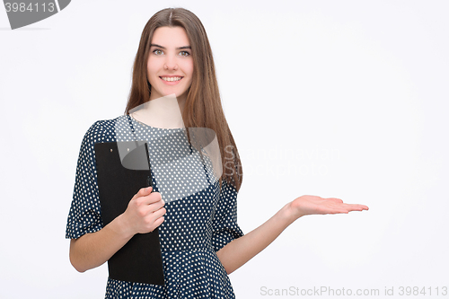 Image of Woman showing something with open hand palm