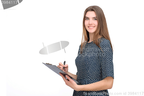 Image of Portrait of smiling business woman with pen and paper folder