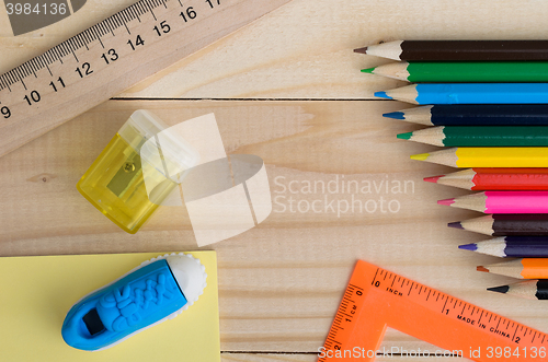 Image of School stationery on wooden board