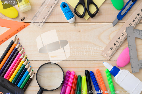 Image of School stationery on wooden board