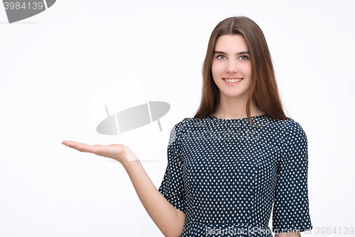 Image of Woman showing something with open hand palm