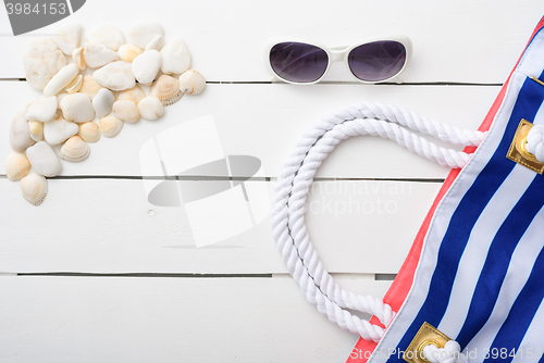 Image of beach accessories on wooden board