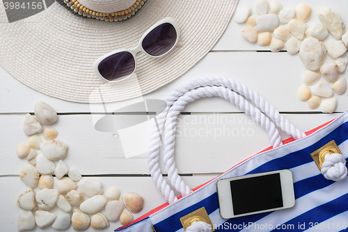 Image of beach accessories on wooden board