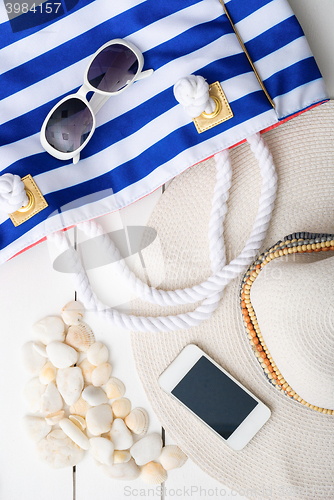 Image of beach accessories on wooden board