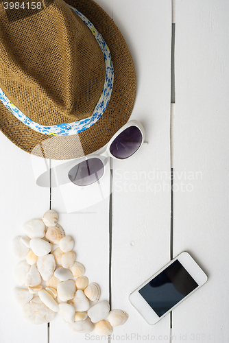 Image of beach accessories on wooden board