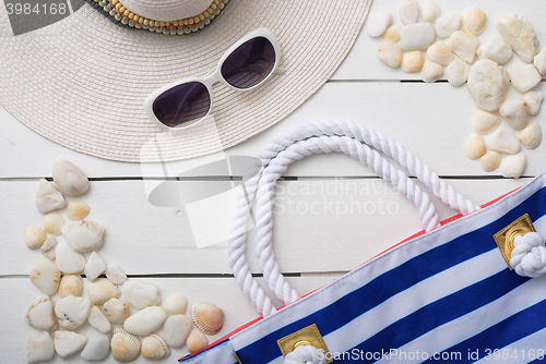Image of beach accessories on wooden board