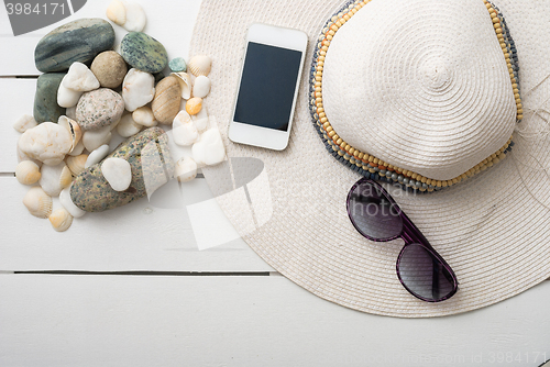 Image of beach accessories on wooden board