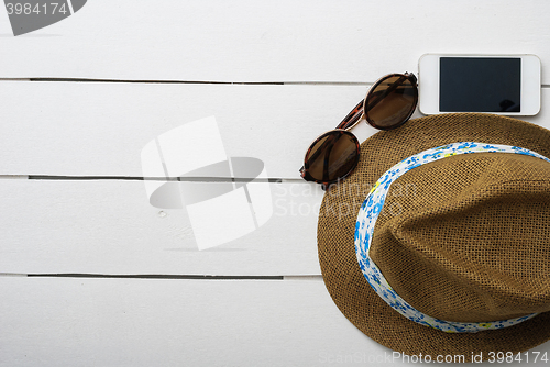 Image of beach accessories on wooden board