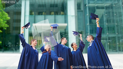 Image of group of smiling students with mortarboards