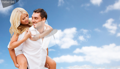 Image of happy couple having fun over blue sky background