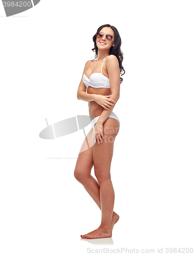 Image of happy woman in sunglasses and bikini swimsuit