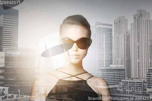 Image of beautiful young woman in elegant black sunglasses