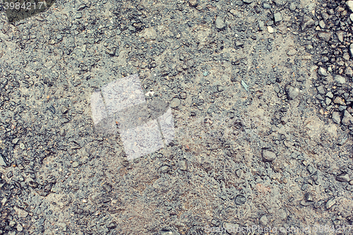 Image of close up of wet gray gravel road or ground