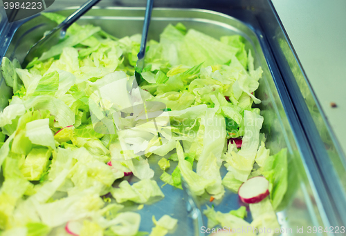 Image of close up of romaine lettuce salad in container