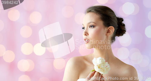 Image of beautiful asian woman with flower and jewelry