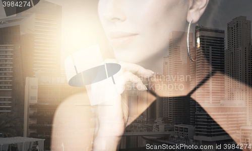 Image of beautiful woman in black wearing diamond jewelry