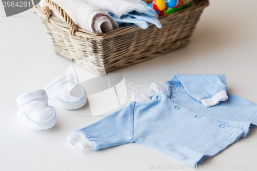 Image of close up of baby clothes for newborn boy in basket