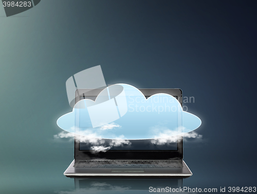 Image of laptop computer with cloud over screen