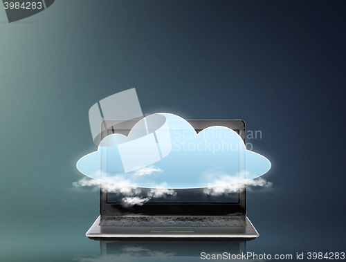 Image of laptop computer with cloud over screen