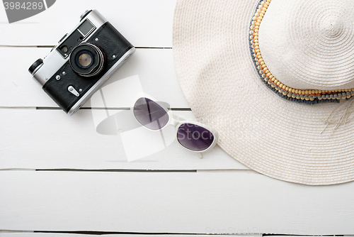 Image of Beach accessories on wooden board