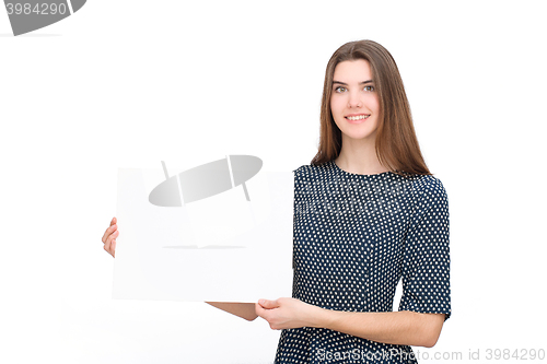Image of Young smiling woman show blank card or paper