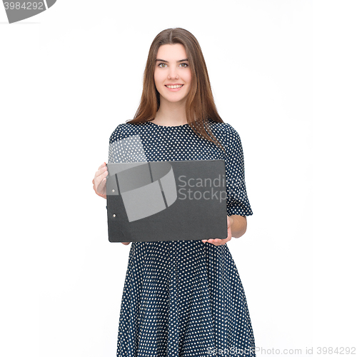 Image of Young smiling woman show blank card or paper