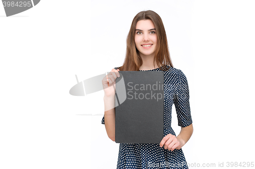 Image of Young smiling woman show blank card or paper