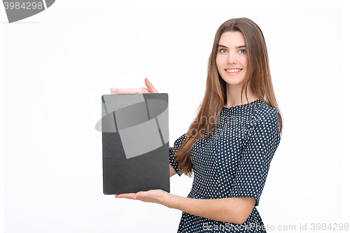 Image of Young smiling woman show blank card or paper