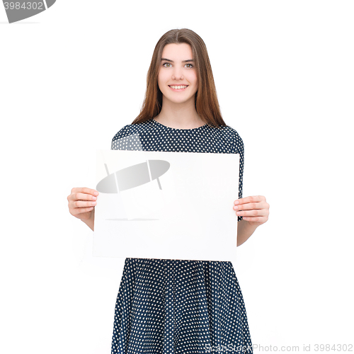 Image of Young smiling woman show blank card or paper